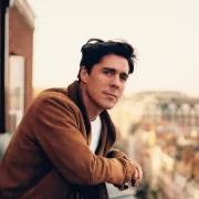 A professional headshot of Ross J. Barr, a renowned acupuncturist known for treating celebrities and wellness seekers, now offering appointments in Edinburgh.