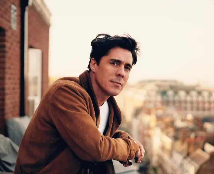 A professional headshot of Ross J. Barr, a renowned acupuncturist known for treating celebrities and wellness seekers, now offering appointments in Edinburgh.