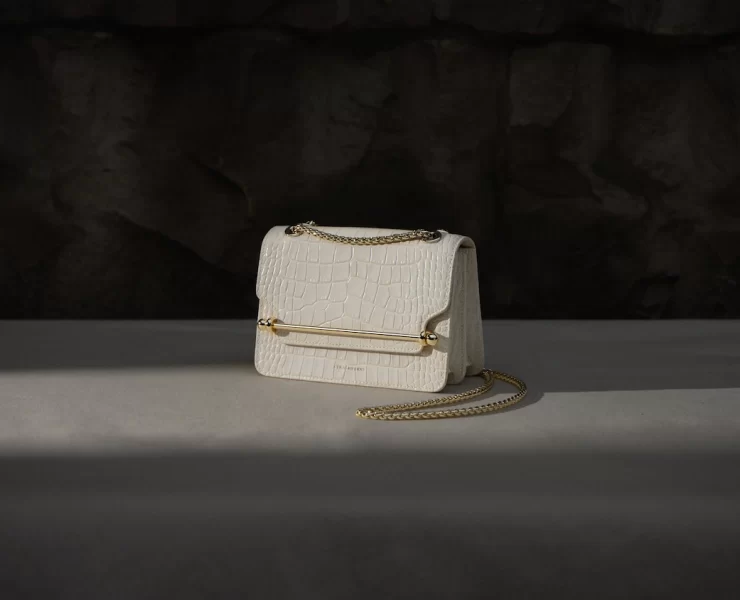 White croc-embossed Strathberry handbag with gold chain strap, part of the 2025 Edinburgh sample sale selection.