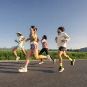 Group of runners enjoying an outdoor run during the ASICS Comfort Tour Glasgow 2025 — a free event for runners of all levels this June