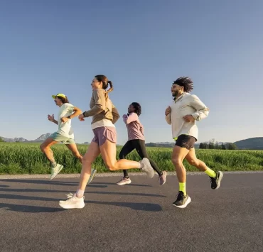 Group of runners enjoying an outdoor run during the ASICS Comfort Tour Glasgow 2025 — a free event for runners of all levels this June