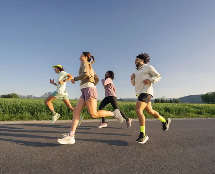 Group of runners enjoying an outdoor run during the ASICS Comfort Tour Glasgow 2025 — a free event for runners of all levels this June