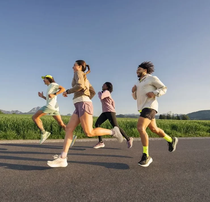 Group of runners enjoying an outdoor run during the ASICS Comfort Tour Glasgow 2025 — a free event for runners of all levels this June