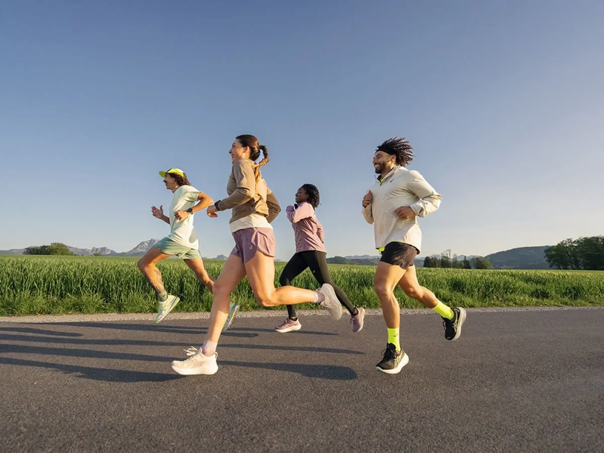 Group of runners enjoying an outdoor run during the ASICS Comfort Tour Glasgow 2025 — a free event for runners of all levels this June