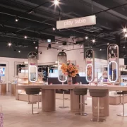 Interactive beauty play table at H beauty Silverburn, showcasing makeup and skincare zones under soft lighting