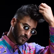 Armand Van Helden wearing sunglasses and a colourful shirt ahead of his Scottish headline set at Hopetoun House Sessions 2025.