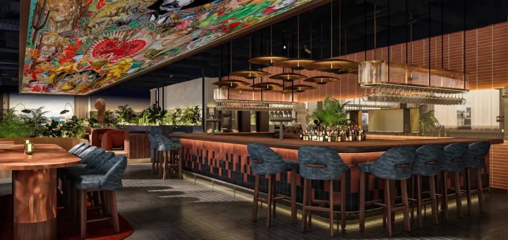 Stylish bar area at SíSí Rooftop in Glasgow featuring plush seating, hanging lights, and vibrant ceiling art