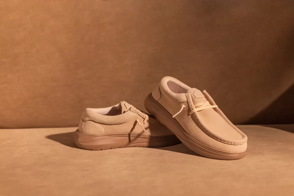 Pair of tan HEYDUDE Wally Stretch Sox shoes from the Lewis Capaldi HEYDUDE Country campaign