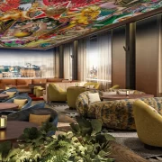 Indoor rooftop lounge with city views at SíSí Glasgow, featuring patterned sofas and soft lighting