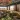 Indoor rooftop lounge with city views at SíSí Glasgow, featuring patterned sofas and soft lighting