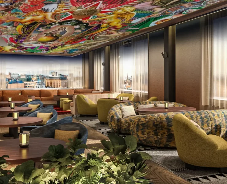 Indoor rooftop lounge with city views at SíSí Glasgow, featuring patterned sofas and soft lighting