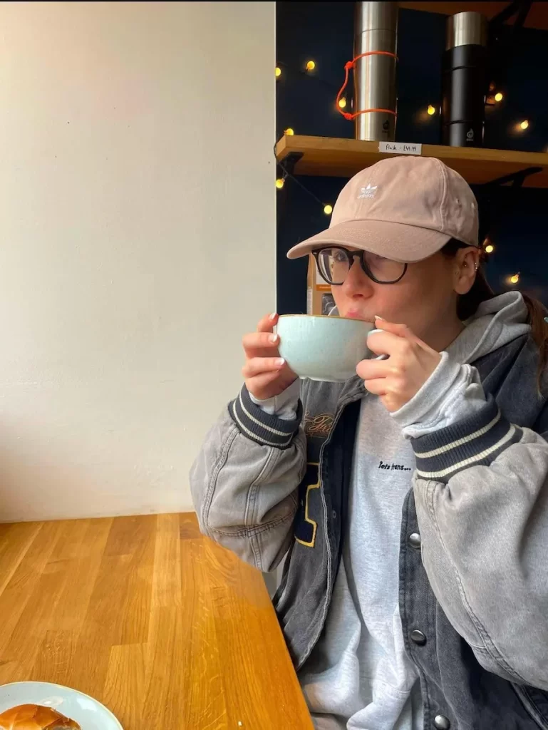 Amyricano creator drinking coffee at one of Edinburgh’s best independent cafés