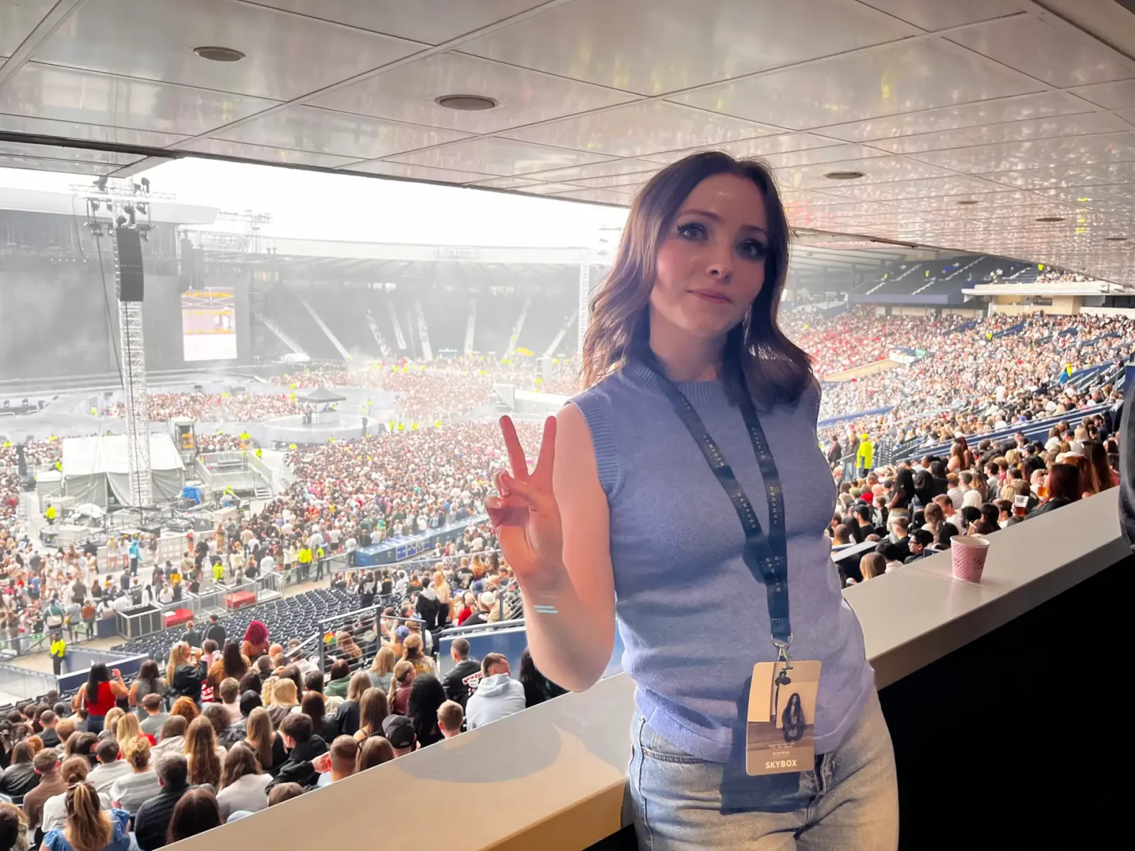 Gemma Meek in the Hampden Park Skybox, posing with a peace sign before Kendrick Lamar and SZA’s concert in July 2025.