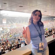 Gemma Meek in the Hampden Park Skybox, posing with a peace sign before Kendrick Lamar and SZA’s concert in July 2025.