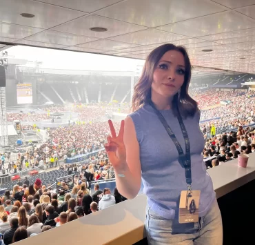 Gemma Meek in the Hampden Park Skybox, posing with a peace sign before Kendrick Lamar and SZA’s concert in July 2025.