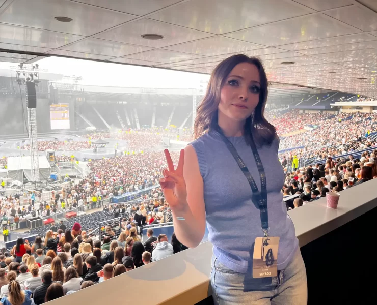 Gemma Meek in the Hampden Park Skybox, posing with a peace sign before Kendrick Lamar and SZA’s concert in July 2025.