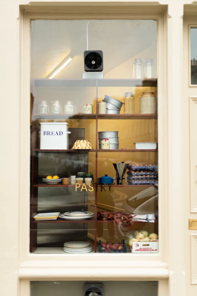Pastry display window at Lannan Pantry with baking ingredients and tins