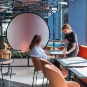 A bartender serves a cocktail to a guest at VEGA Glasgow, the city centre rooftop bar with panoramic views and Glasgow’s first customisable cocktail night out.
