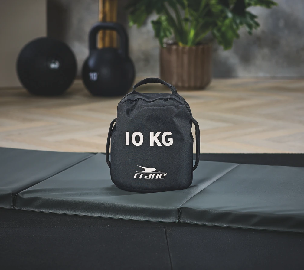 Aldi Crane 10kg weighted fitness bag on a foldable mat.