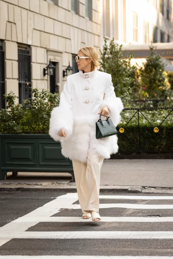 Kelly Rutherford street style at New York Fashion Week carrying a Strathberry Mini Tote.