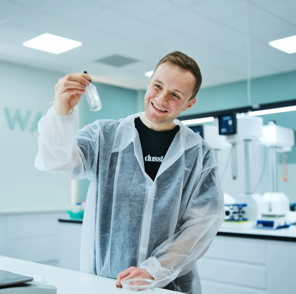 Fraser Wilson, founder of dussl skincare, photographed in a lab setting ahead of his appearance at Bright Minds Glasgow, Quine Magazine’s new event series for Scotland’s young founders.