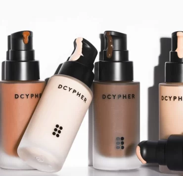 DCYPHER Beauty custom foundation bottles in multiple skin tones with pump applicators.
