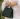 Close-up of the Strathberry Mini Tote bag in green embossed croc leather with gold bar.
