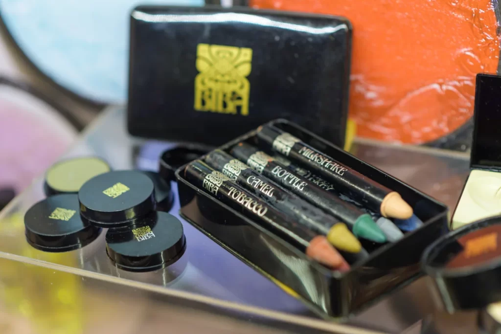Original Biba cosmetics on display with signature black and gold packaging