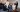 Group of women dressed in Gormley & Gamble tailored suits raising champagne glasses in celebration at Gleneagles Townhouse Edinburgh