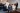 Group of women dressed in Gormley & Gamble tailored suits raising champagne glasses in celebration at Gleneagles Townhouse Edinburgh