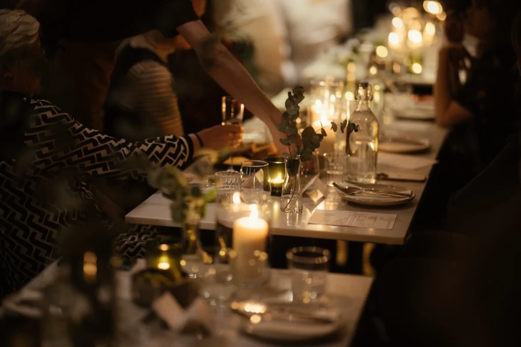 Candlelit long-table dinner setting at Five March restaurant in Glasgow’s West End, set for the Samhain celebration feast.