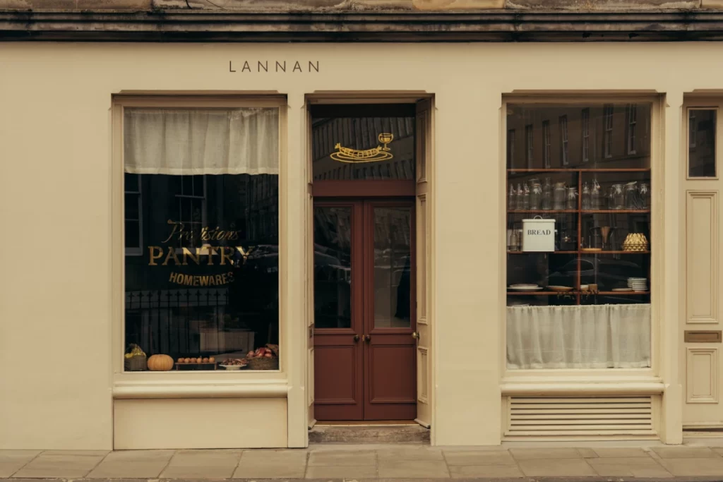 Exterior of Lannan Pantry in Stockbridge, Edinburgh, showing traditional shopfront and homewares in the window.