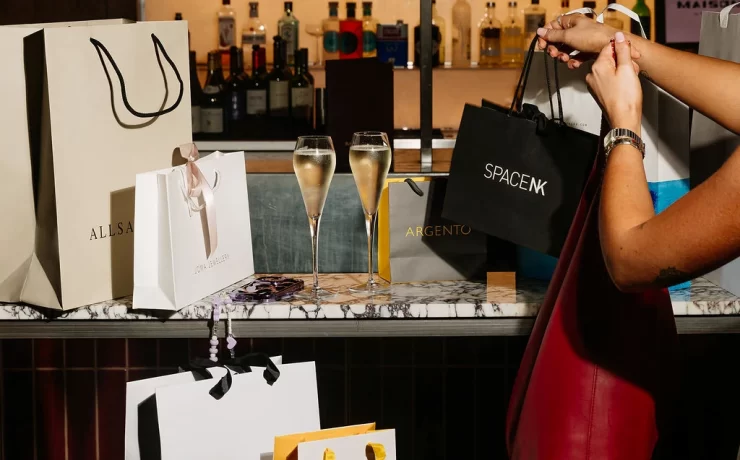 Champagne glasses and shopping bags from AllSaints, Space NK and other brands at Princes Square Glasgow.