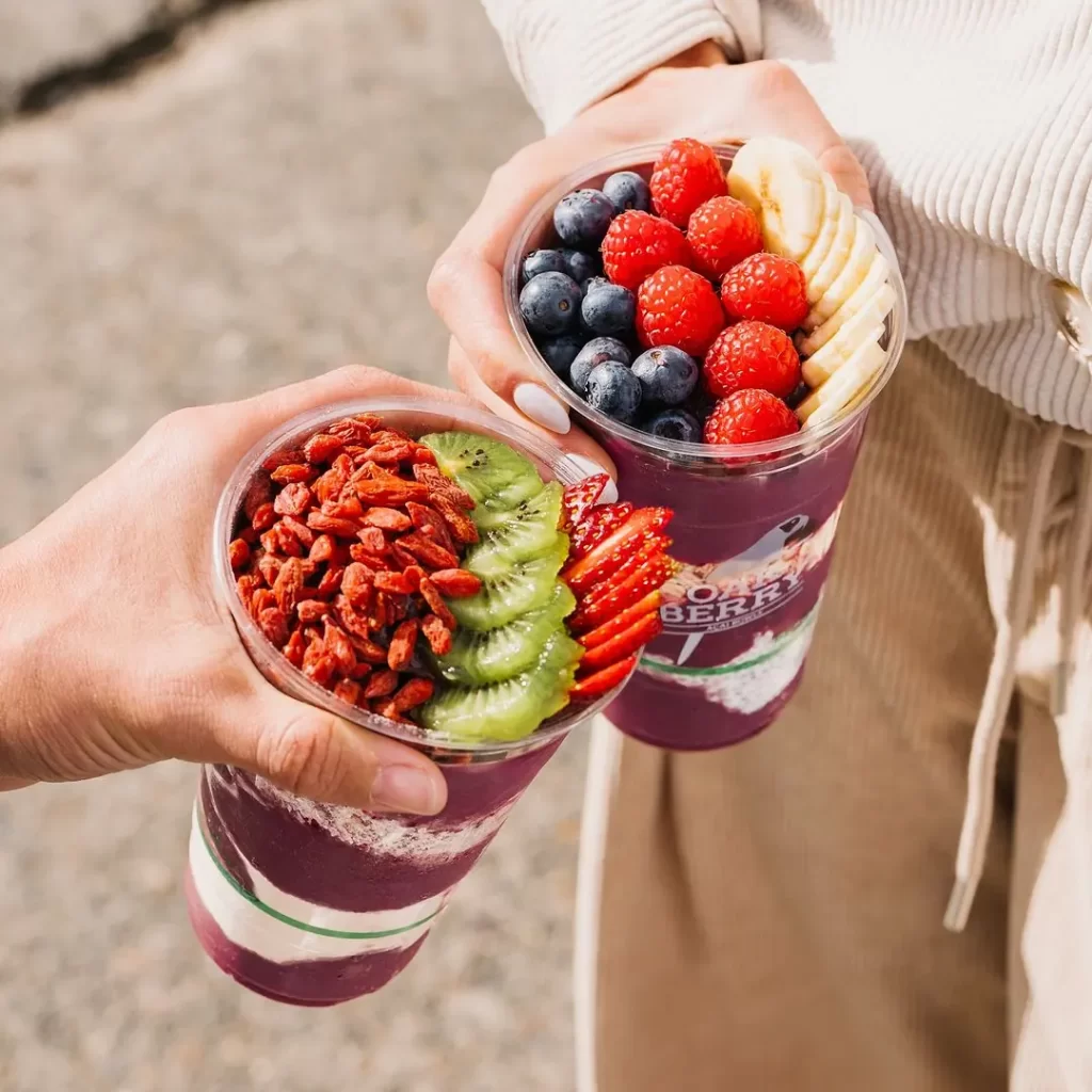 Two açaí bowls topped with fruit and granola from OAKBERRY Açaí Edinburgh.